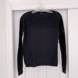 Merino wool sweater with open detail on yoke and sleeve.  Excellent condition